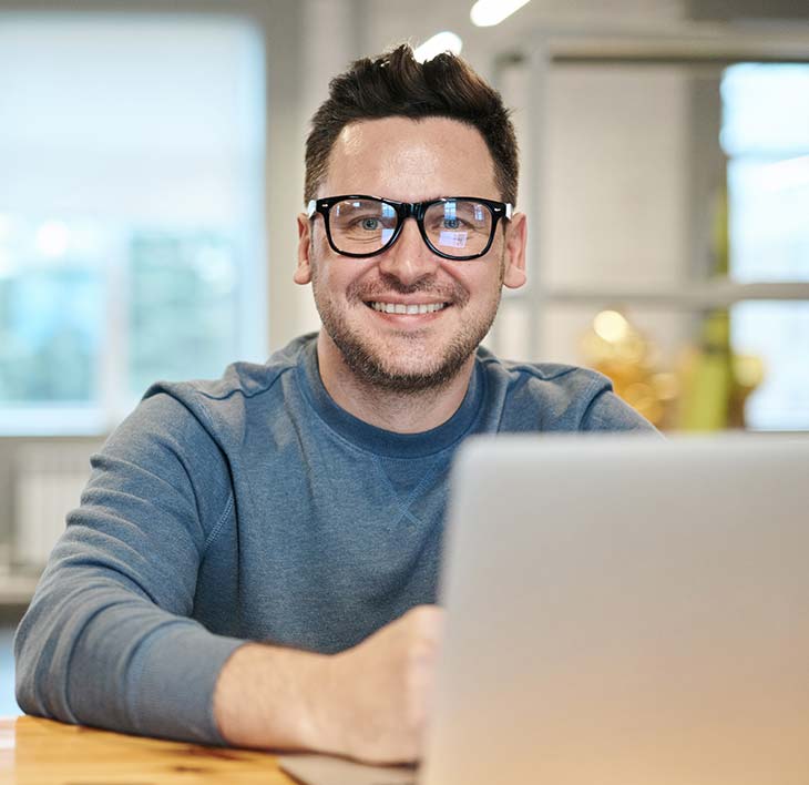 Customer Testimonial man sitting at computer